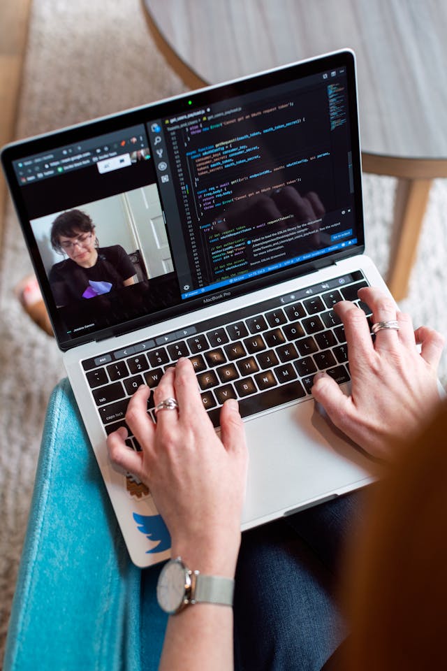 Person using gray laptop while on a video call
